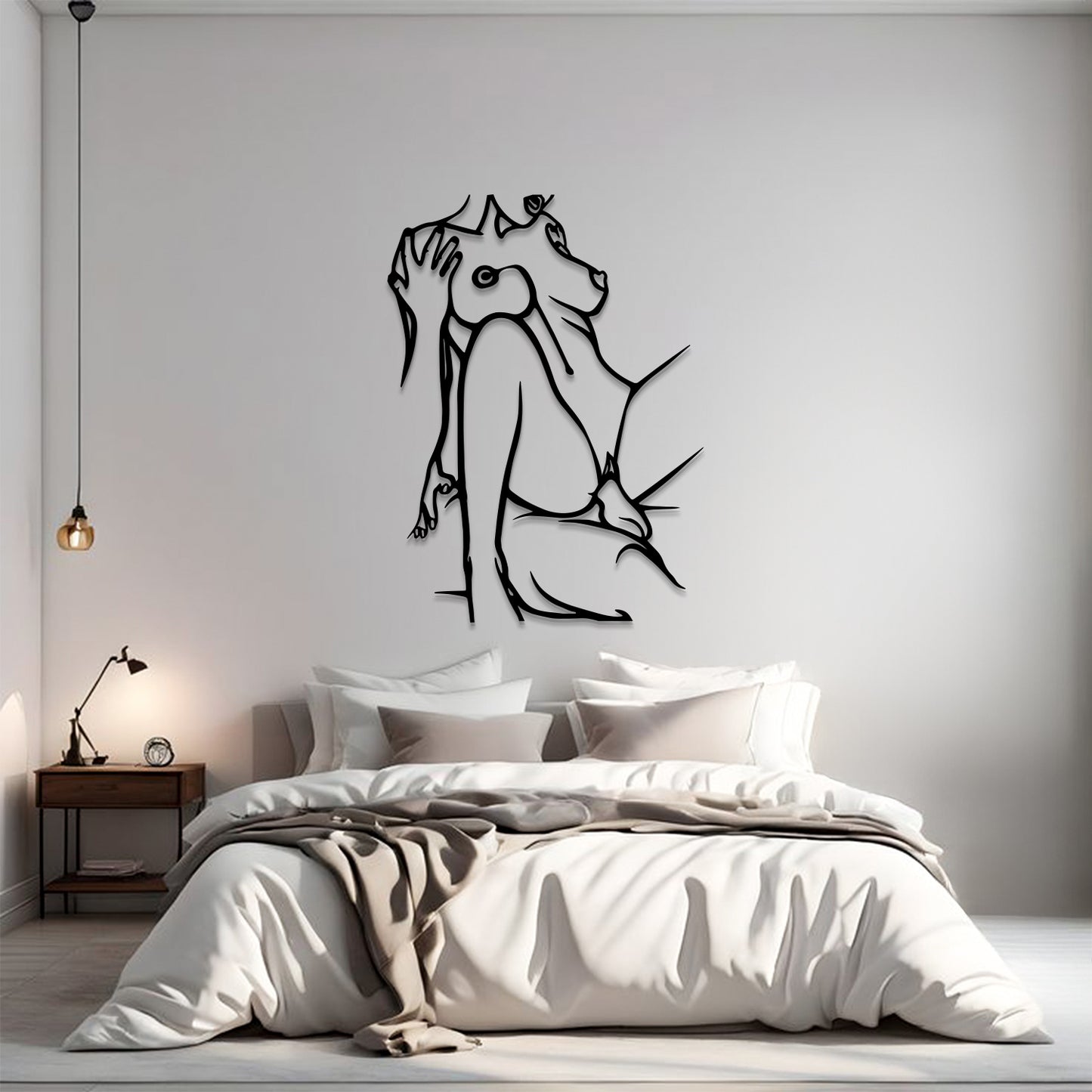 A modern bedroom scene with a minimalist black line art wall decal of a dog sitting up on the wall above a neatly made bed with white and beige bedding.