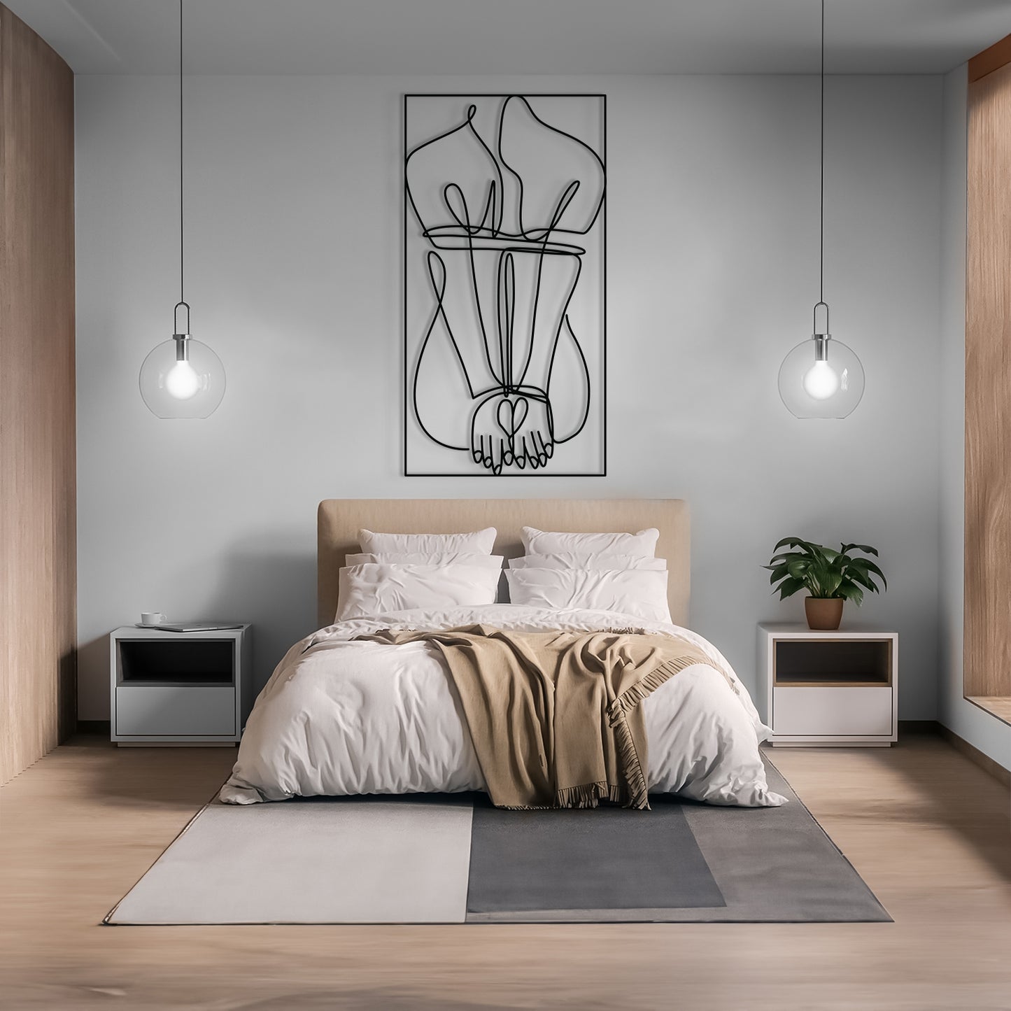 A modern bedroom scene with a neatly made bed centered against a light gray wall, featuring a black line art wall hanging above the headboard. Two pendant lights hang on either side, with matching side tables, a small potted plant, and a geometric area rug on the floor.