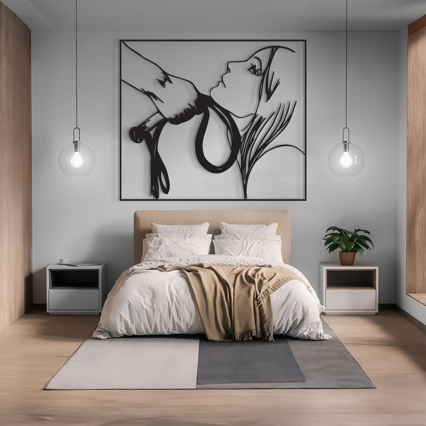 A modern bedroom featuring a large black and white minimalist line art wall sculpture of a woman's face and hands, displayed above a beige upholstered bed with white bedding and a tan throw blanket.