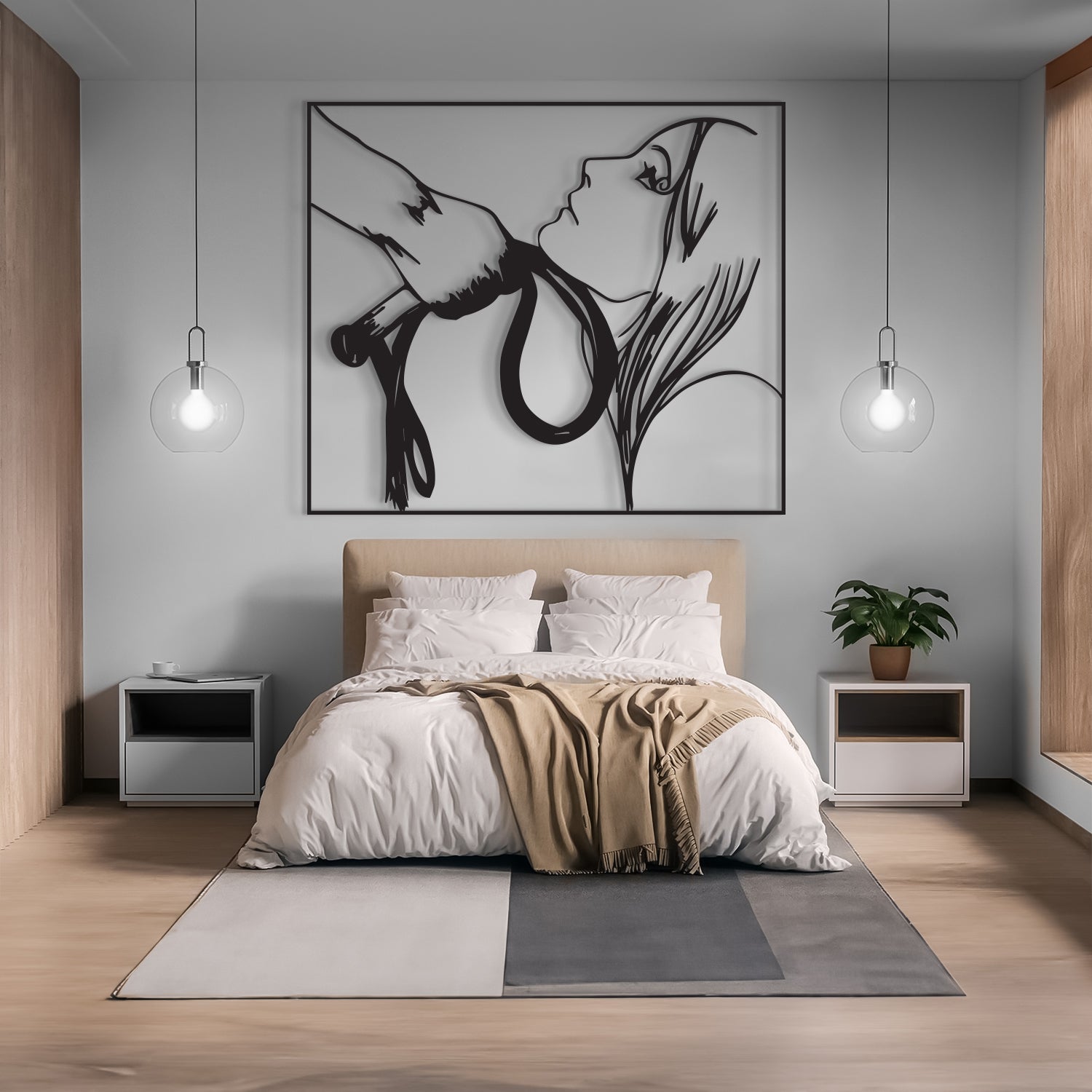 A modern bedroom featuring a large black and white minimalist line art wall sculpture of a woman's face and hands, displayed above a beige upholstered bed with white bedding and a tan throw blanket.