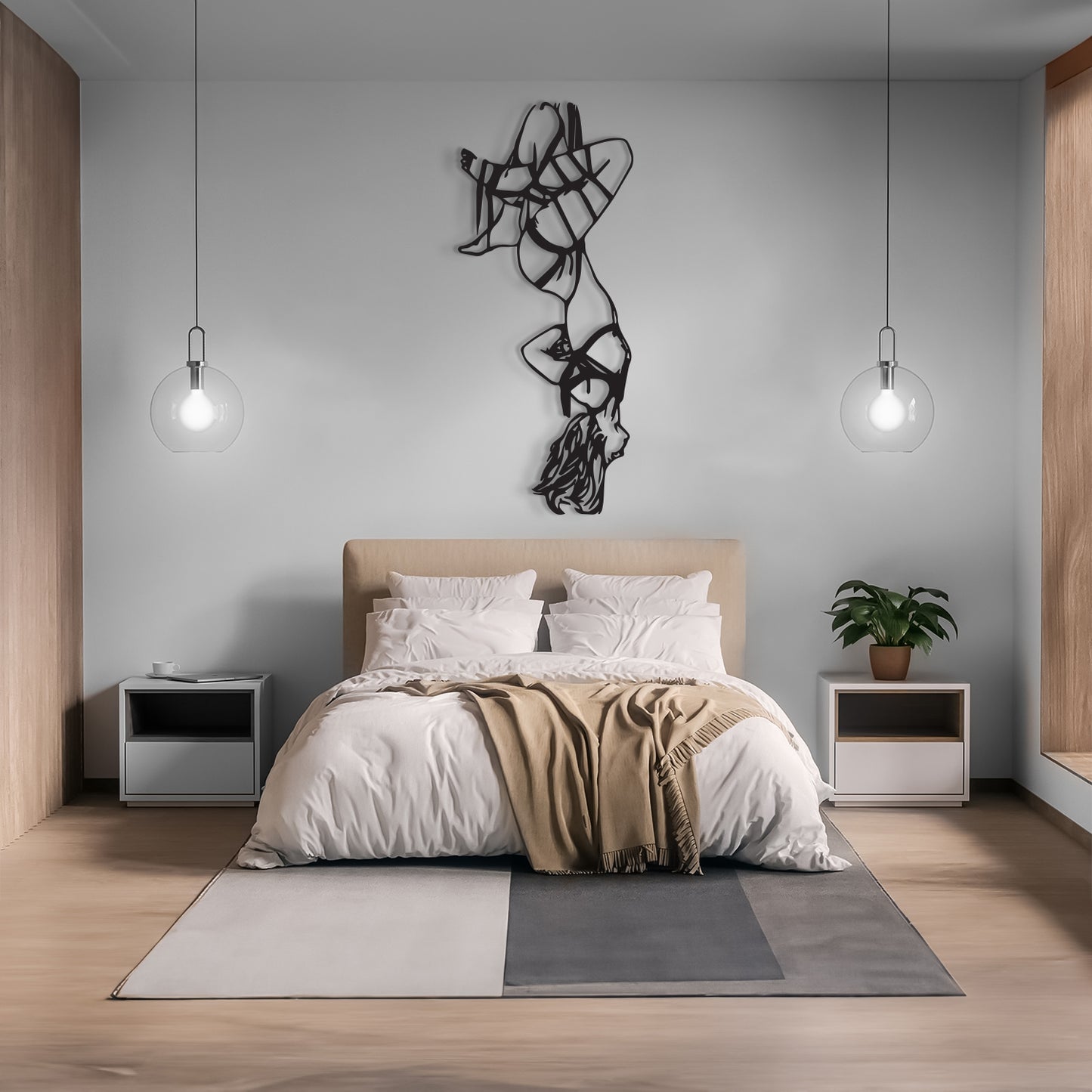 A modern minimalist bedroom featuring a bed with white bedding and a beige throw blanket, flanked by two white nightstands with silver accents. The room has light wood flooring, a gray wall with a black wire art piece, and two hanging glass globe lights.