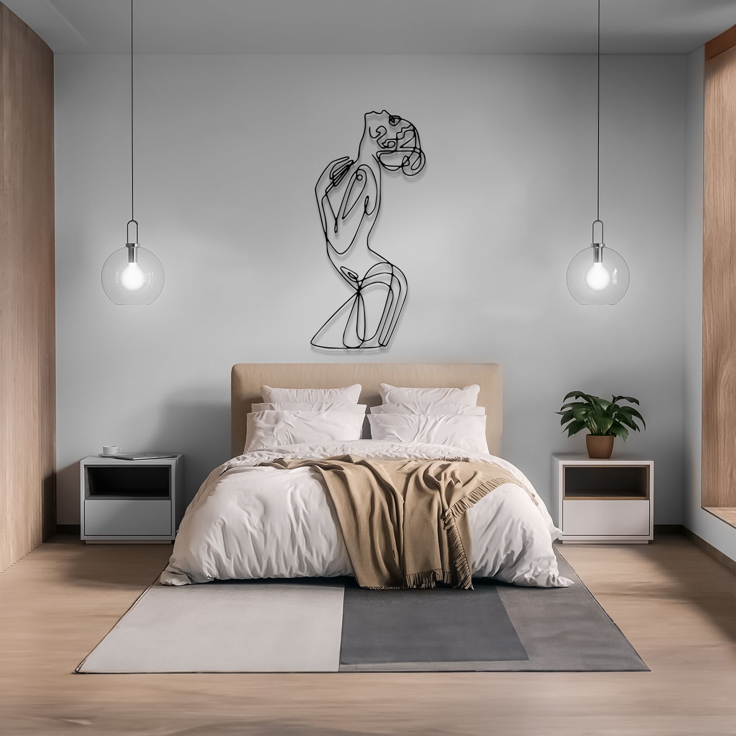 A modern bedroom featuring a minimalist beige bed with white linens and a tan throw blanket, flanked by two white nightstands and two hanging glass globe lights. A black wire art piece of a woman is mounted on the light gray wall above the headboard.