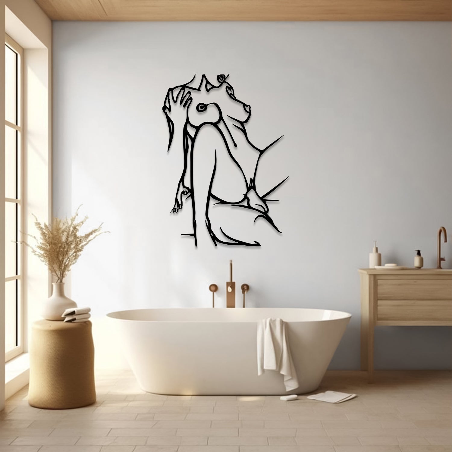 A black metal wall art piece depicting a seated dog, displayed in a modern bathroom setting above a white freestanding bathtub.