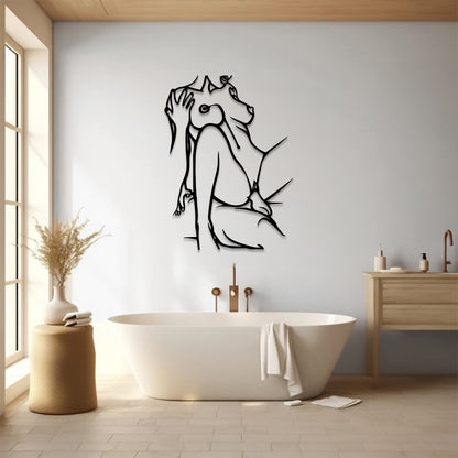 A black metal wall art piece depicting a seated dog, displayed in a modern bathroom setting above a white freestanding bathtub.
