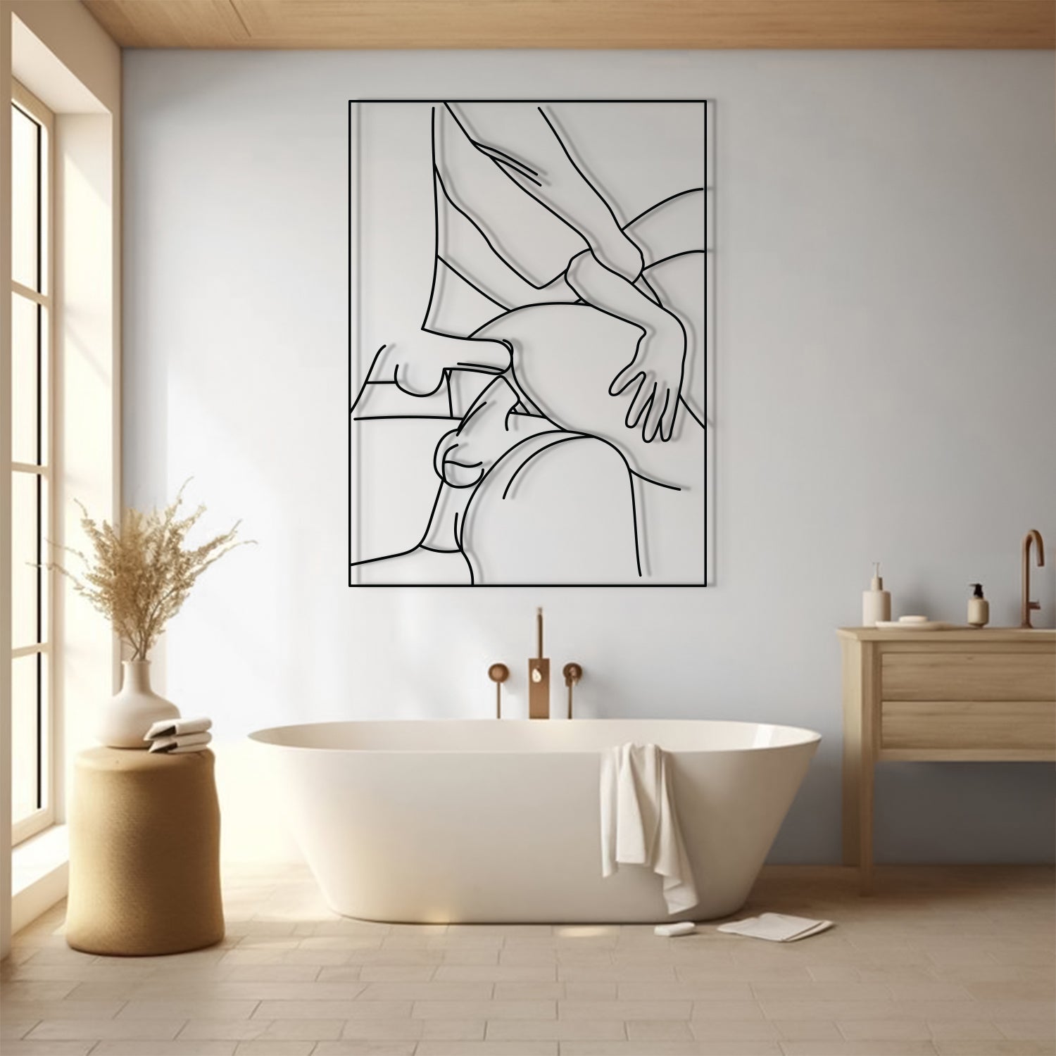 A minimalist black and white line art canvas print of a massage scene, displayed on a light gray wall above a white freestanding bathtub in a modern, sunlit bathroom.