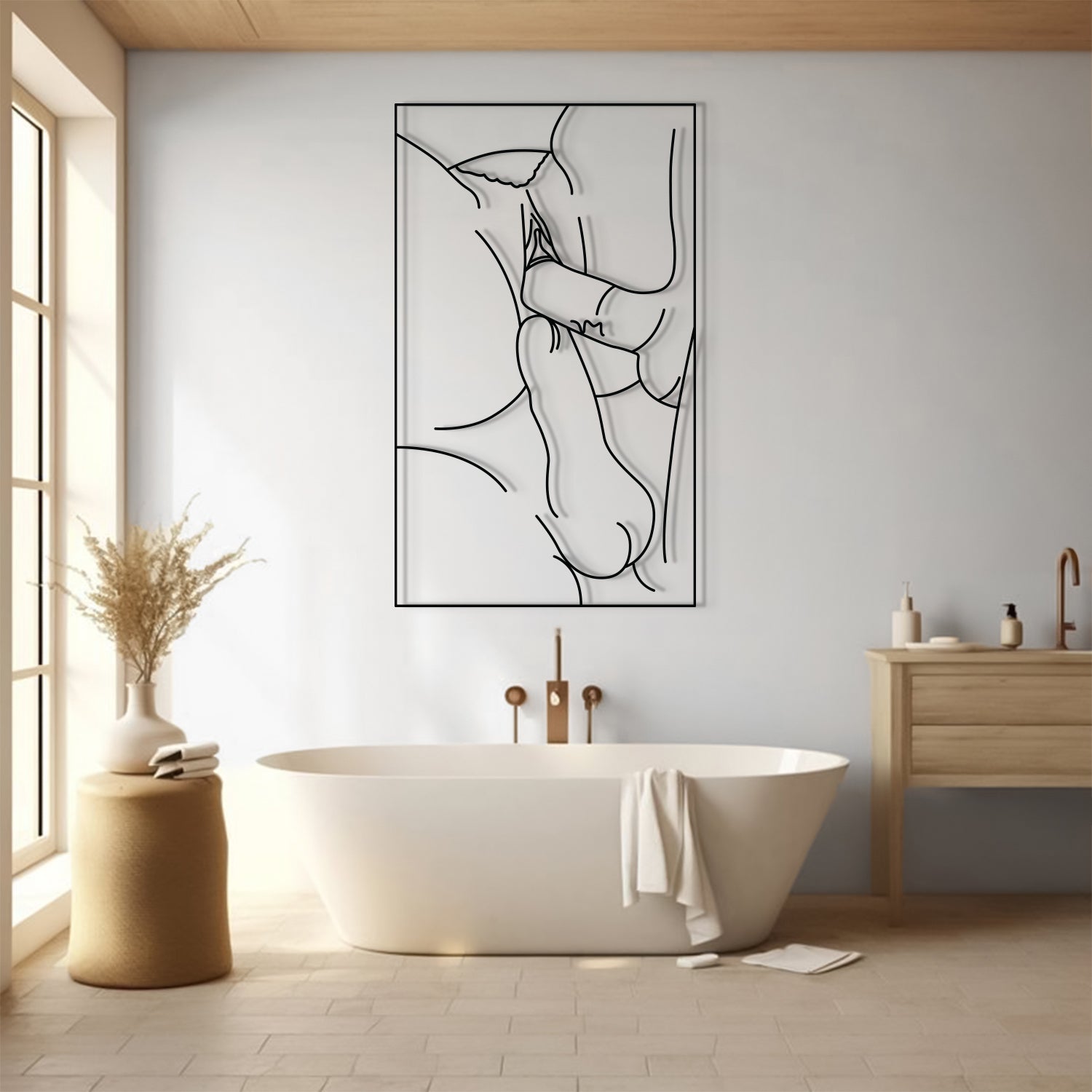 A minimalist black and white line art print of abstract human anatomy hangs on a light gray wall in a modern bathroom setting with a freestanding bathtub, wooden vanity, and warm natural light.