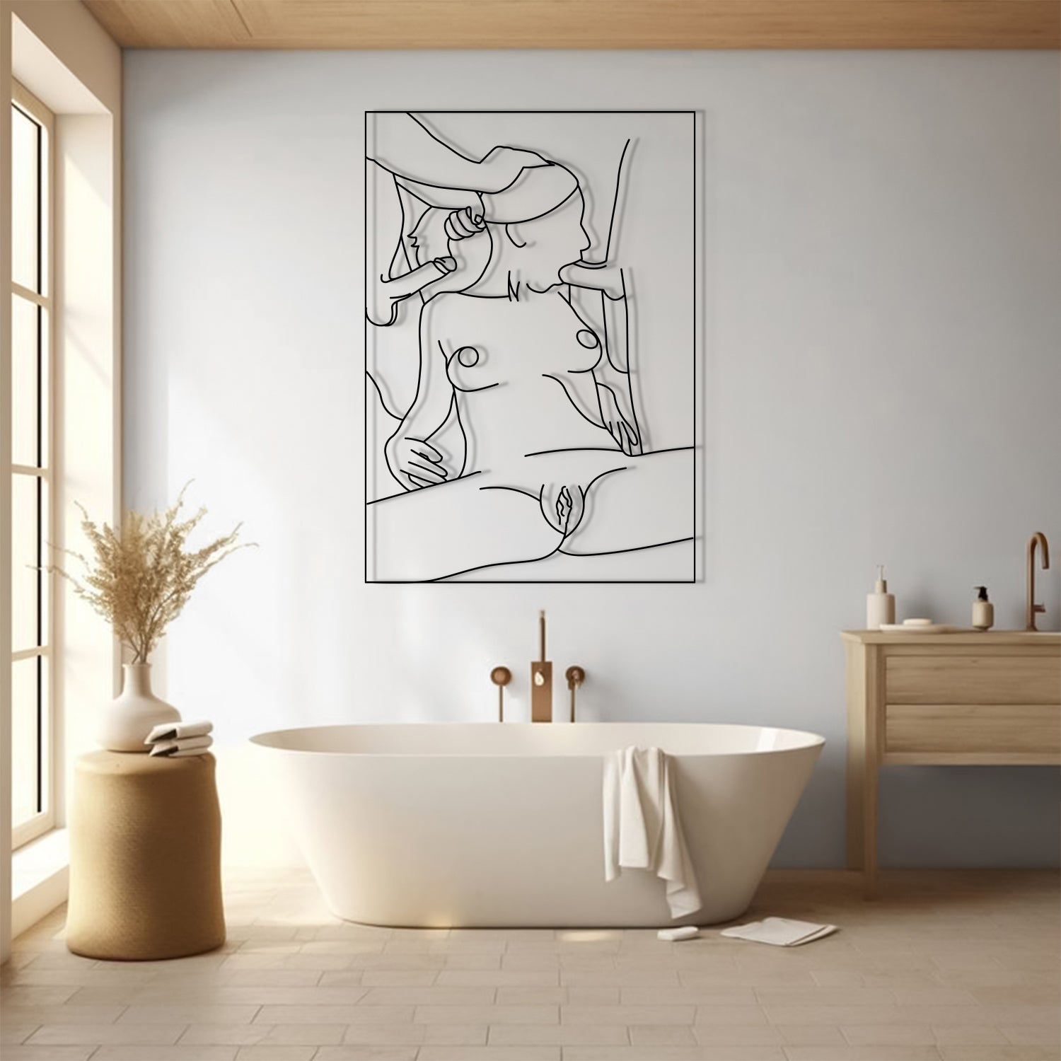 A minimalist black and white continuous line art print of a nude female figure, displayed on a light gray wall in a modern bathroom setting above a freestanding bathtub.