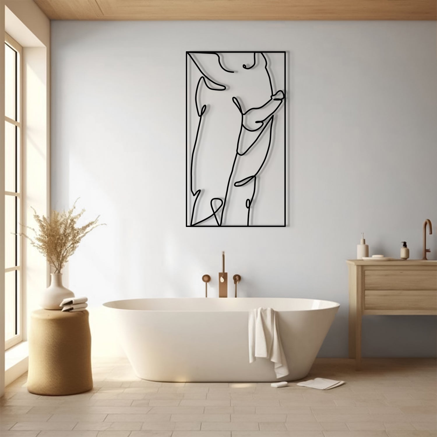 A minimalist black line art wall hanging depicting an abstract female figure, displayed in a modern bathroom above a freestanding white bathtub.