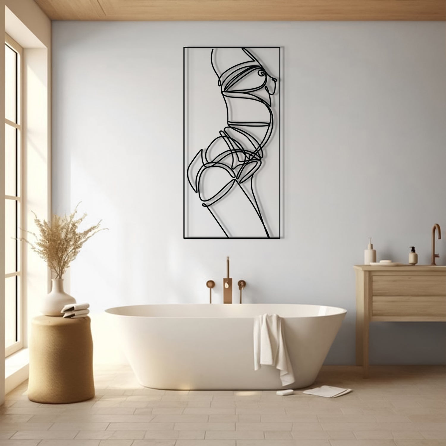A minimalist black line art print of a dancer's body in motion, displayed on a light gray wall in a modern bathroom setting with a freestanding bathtub and wooden vanity.