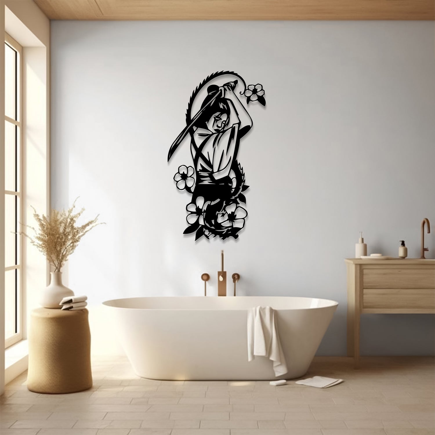A black metal wall art piece depicting a woman with a scythe and flowers, mounted on a light gray wall above a modern freestanding bathtub in a bright, minimalist bathroom.