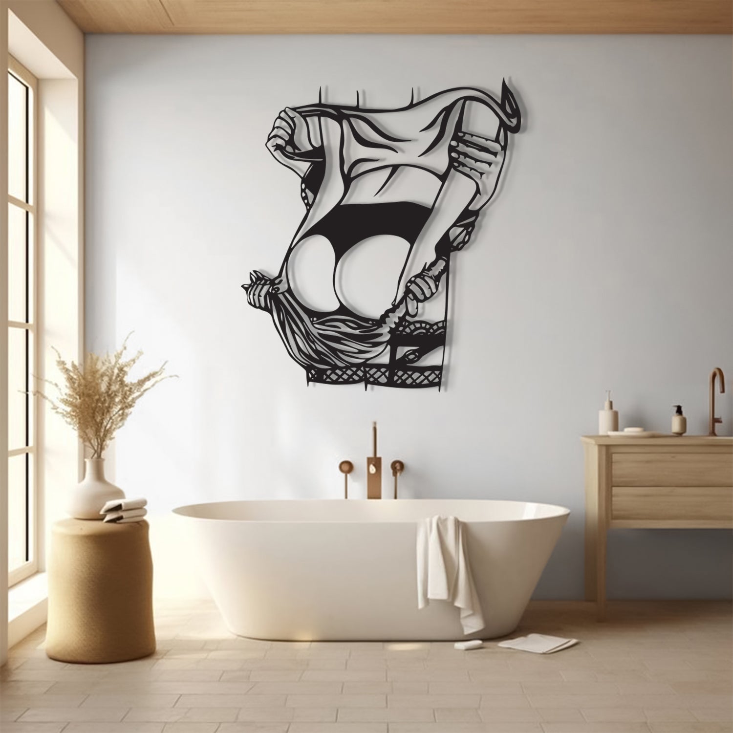 A black metal wall art piece depicting a woman lifting her skirt, displayed on a light gray wall above a white freestanding bathtub in a modern bathroom setting.