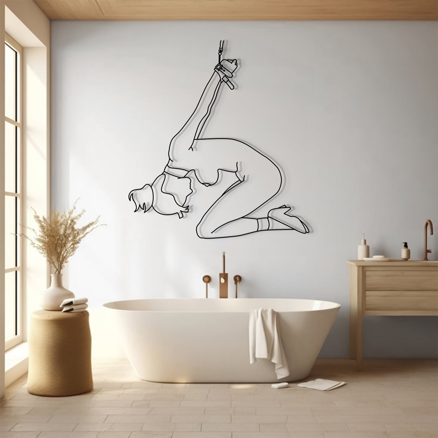 Bathroom interior with a modern bathtub and wall art of a person in a yoga pose.