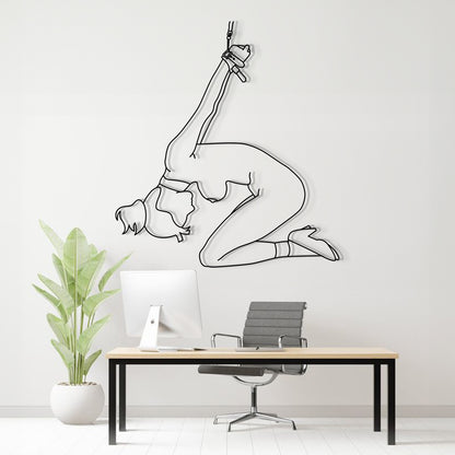 Modern office interior with a wall decal of a woman in a yoga pose.