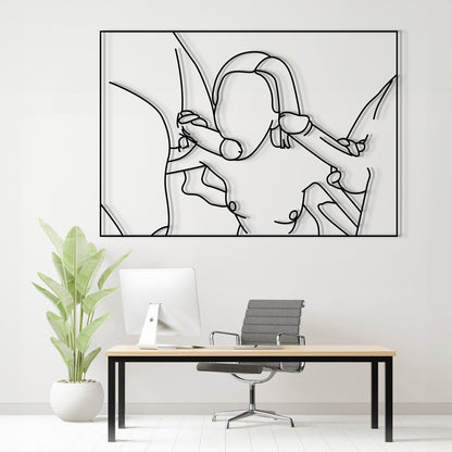 A minimalist black and white continuous line art print of a woman is displayed on a white wall above a modern desk setup with a computer, office chair, and a potted plant.