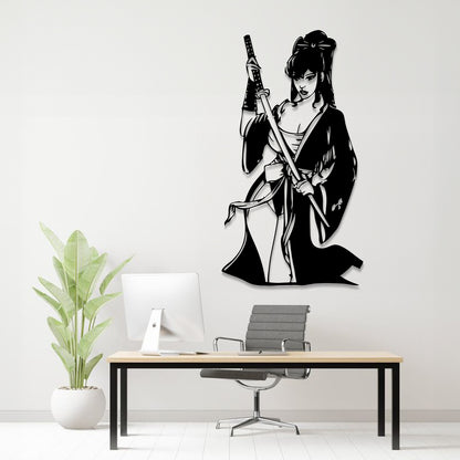 A black metal wall art piece depicting a samurai woman holding a sword, displayed on a white wall above a modern desk setup with a computer, chair, and potted plant.