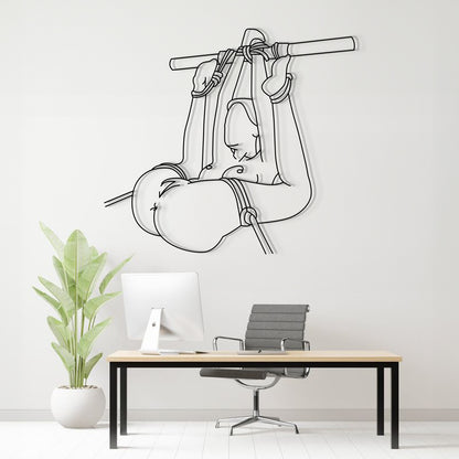 Wall decal of a person in a hammock above a desk with a plant and chair.