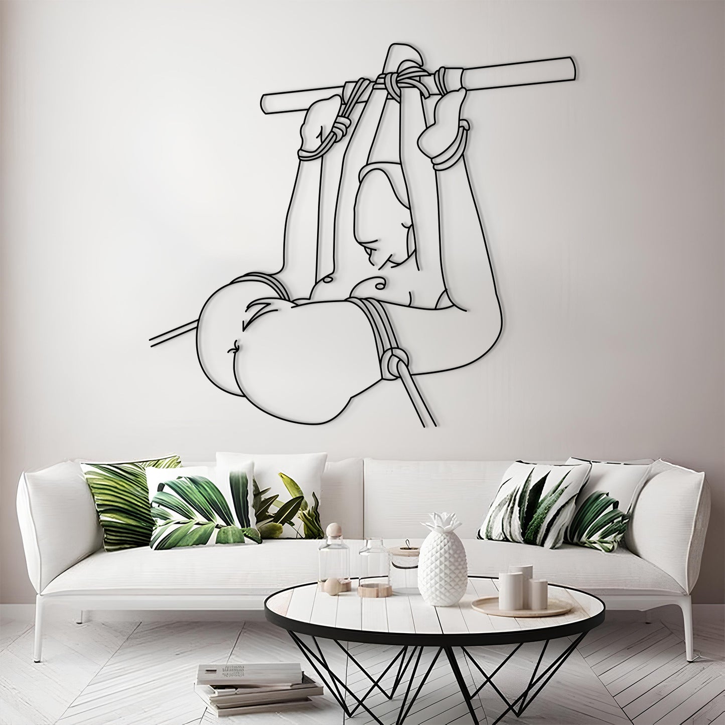 Modern living room with a white sofa, decorative pillows, and a wall art of a monkey holding a banana.