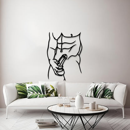 A modern living room scene featuring a black metal wall art piece of a muscular torso with a peace sign, mounted on a light gray wall above a white sofa with green leaf-patterned pillows.