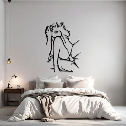 A modern bedroom scene with a minimalist black line art wall decal of a dog sitting up on the wall above a neatly made bed with white and beige bedding.