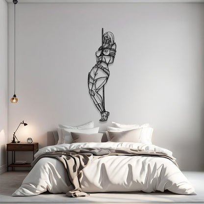 Bedroom with a modern wall sculpture of a woman sitting on a chair.