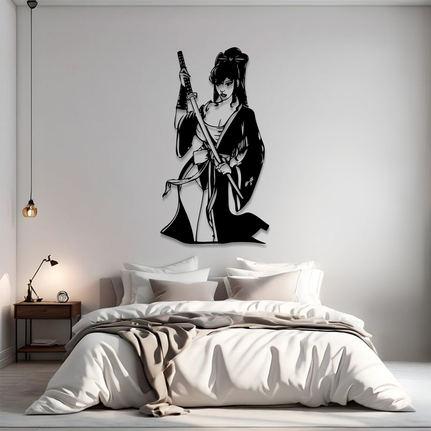 A black vinyl wall decal of a samurai woman holding a sword, displayed on a light gray wall above a neatly made bed in a modern bedroom setting.