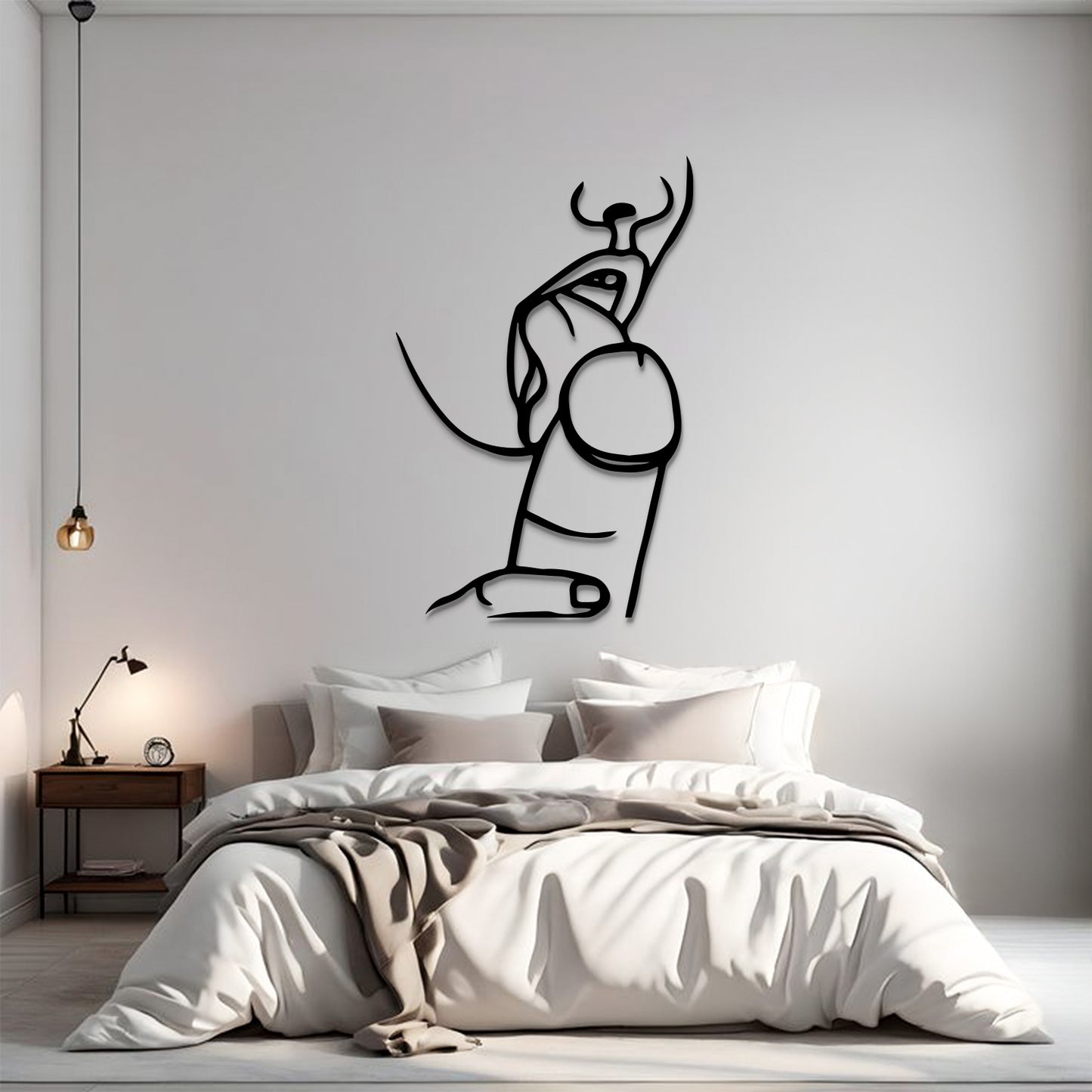 A minimalist black line art wall decal of a bull and pillar, displayed on a light gray wall above a modern bed in a styled bedroom setting.
