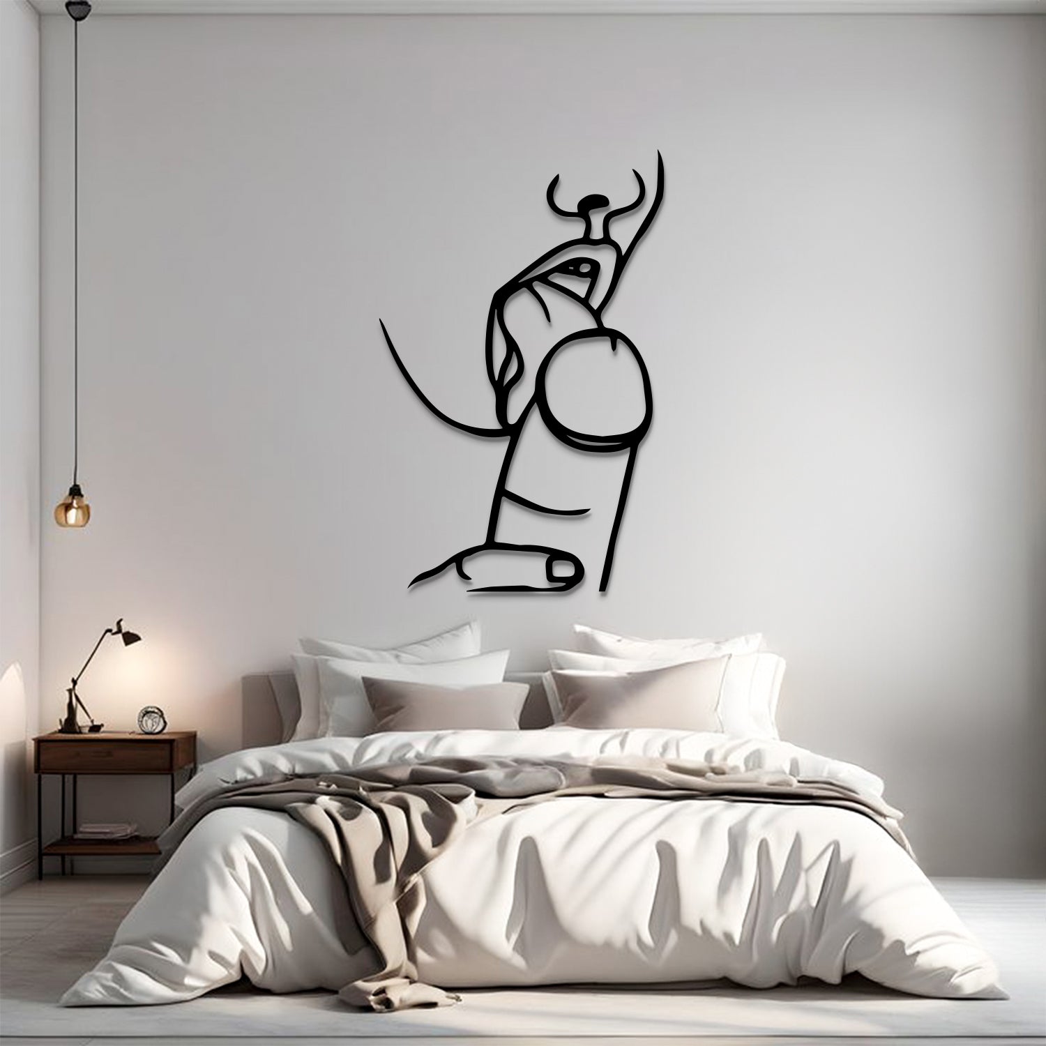 A minimalist black line art wall decal of a bull and pillar, displayed on a light gray wall above a modern bed in a styled bedroom setting.