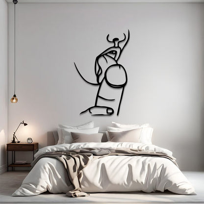 A minimalist black line art wall decal of a bull and pillar, displayed on a light gray wall above a modern bed in a styled bedroom setting.