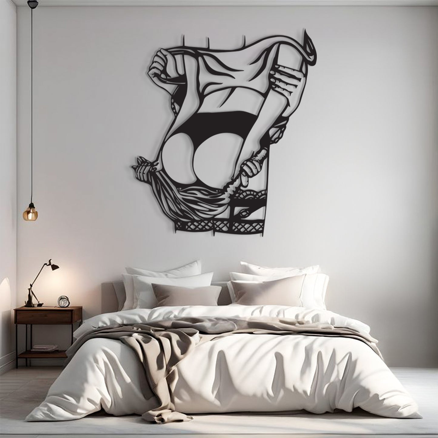 A black metal wall art piece depicting a stylized, abstract female figure in a flowing dress, mounted on a light gray wall above a neatly made bed in a modern bedroom setting.