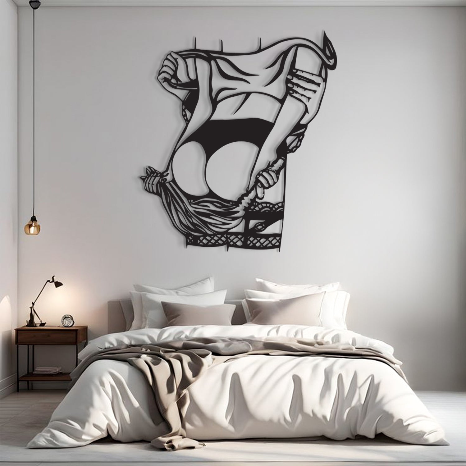A black metal wall art piece depicting a stylized, abstract female figure in a flowing dress, mounted on a light gray wall above a neatly made bed in a modern bedroom setting.