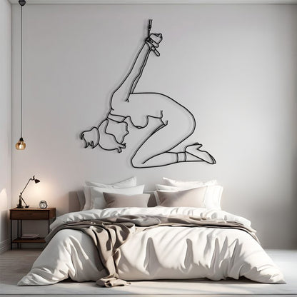 Bedroom with a wall decal of a dancer in a split pose.