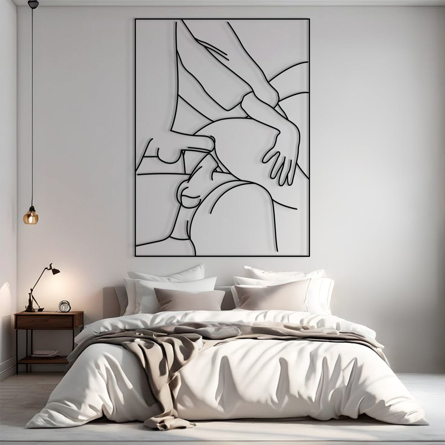 A minimalist black and white continuous line art poster of a couple, displayed on a light gray wall above a neatly made bed in a modern, softly lit bedroom.