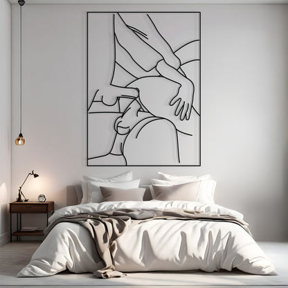 A minimalist black and white continuous line art poster of a couple, displayed on a light gray wall above a neatly made bed in a modern, softly lit bedroom.