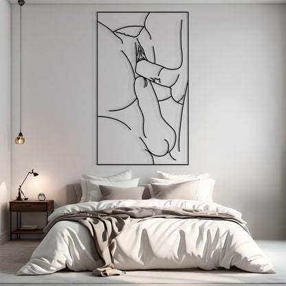 A minimalist black and white continuous line art print of a pregnant woman and baby, displayed on a light gray wall above a neatly made bed in a modern bedroom setting.