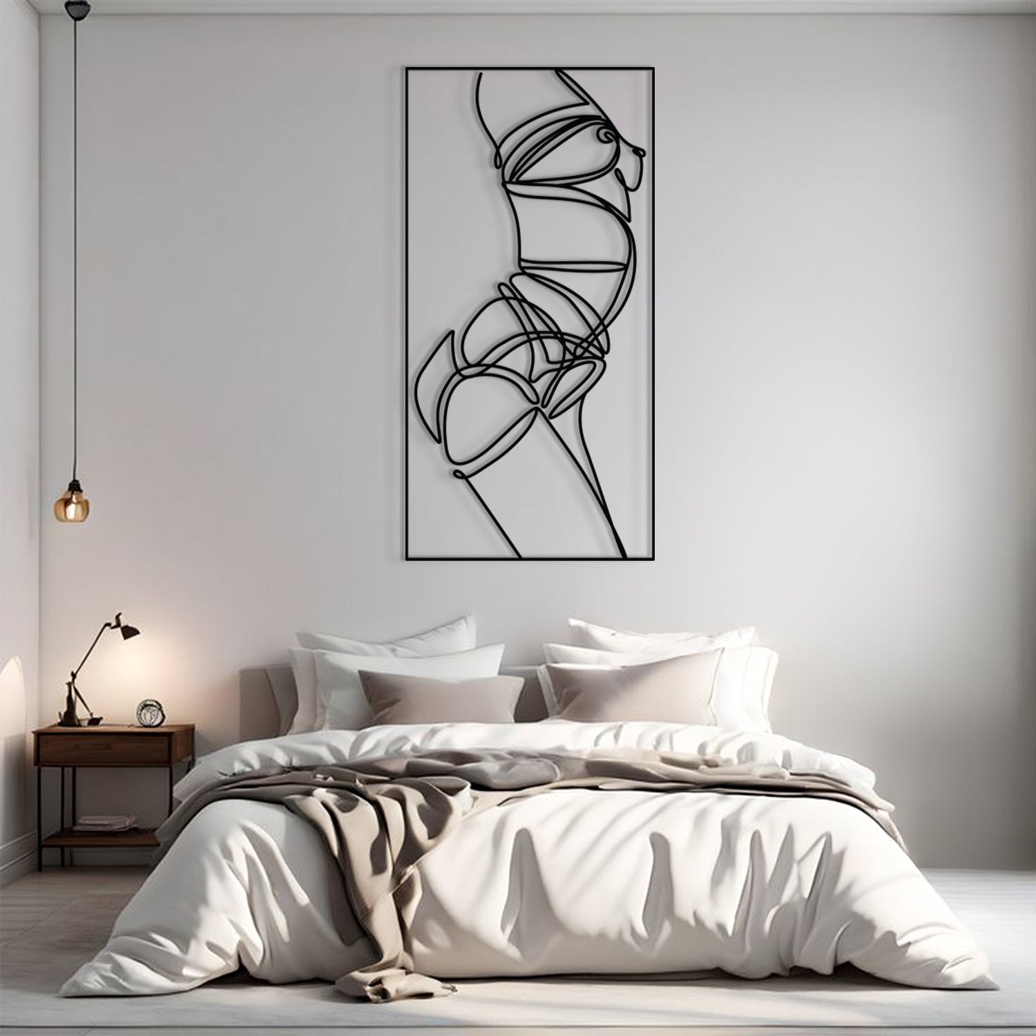 A minimalist black and white continuous line art print of a female figure, displayed on a light gray wall above a neatly made bed in a modern bedroom setting.